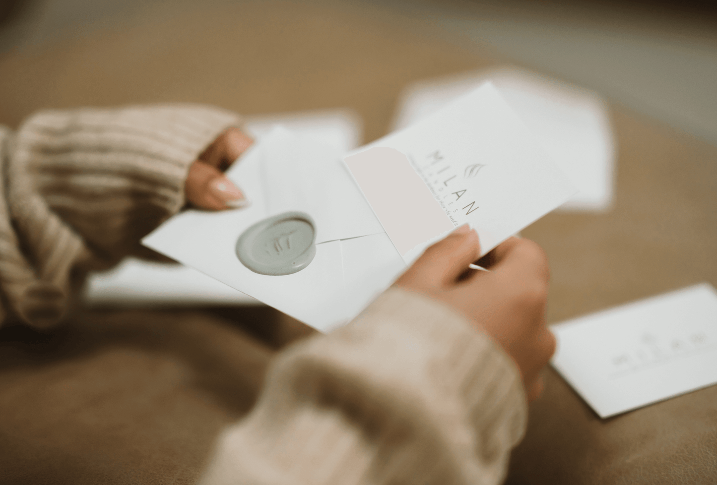 A Woman holding a Milan Candle Mission card